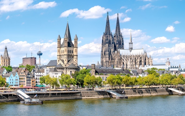 Cologne Cathedral and cityscape along the Rhine River in Cologne, Germany.