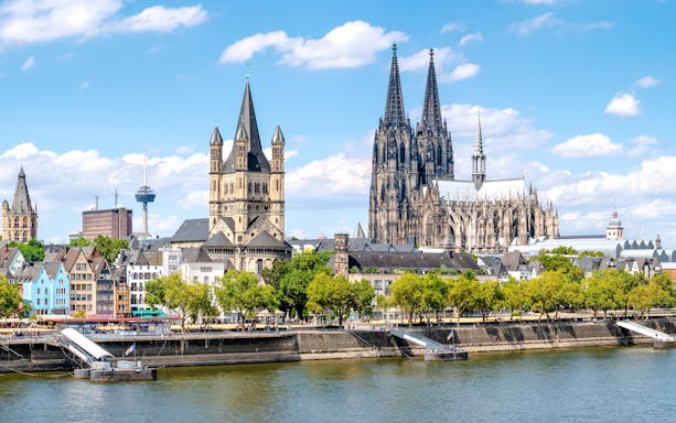 Cologne Cathedral and cityscape along the Rhine River in Cologne, Germany.