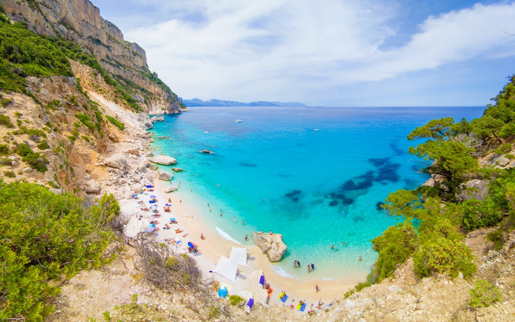Cala Goloritze beach with turquoise waters and rocky cliffs, Gulf of Orosei, Sardinia, Italy.