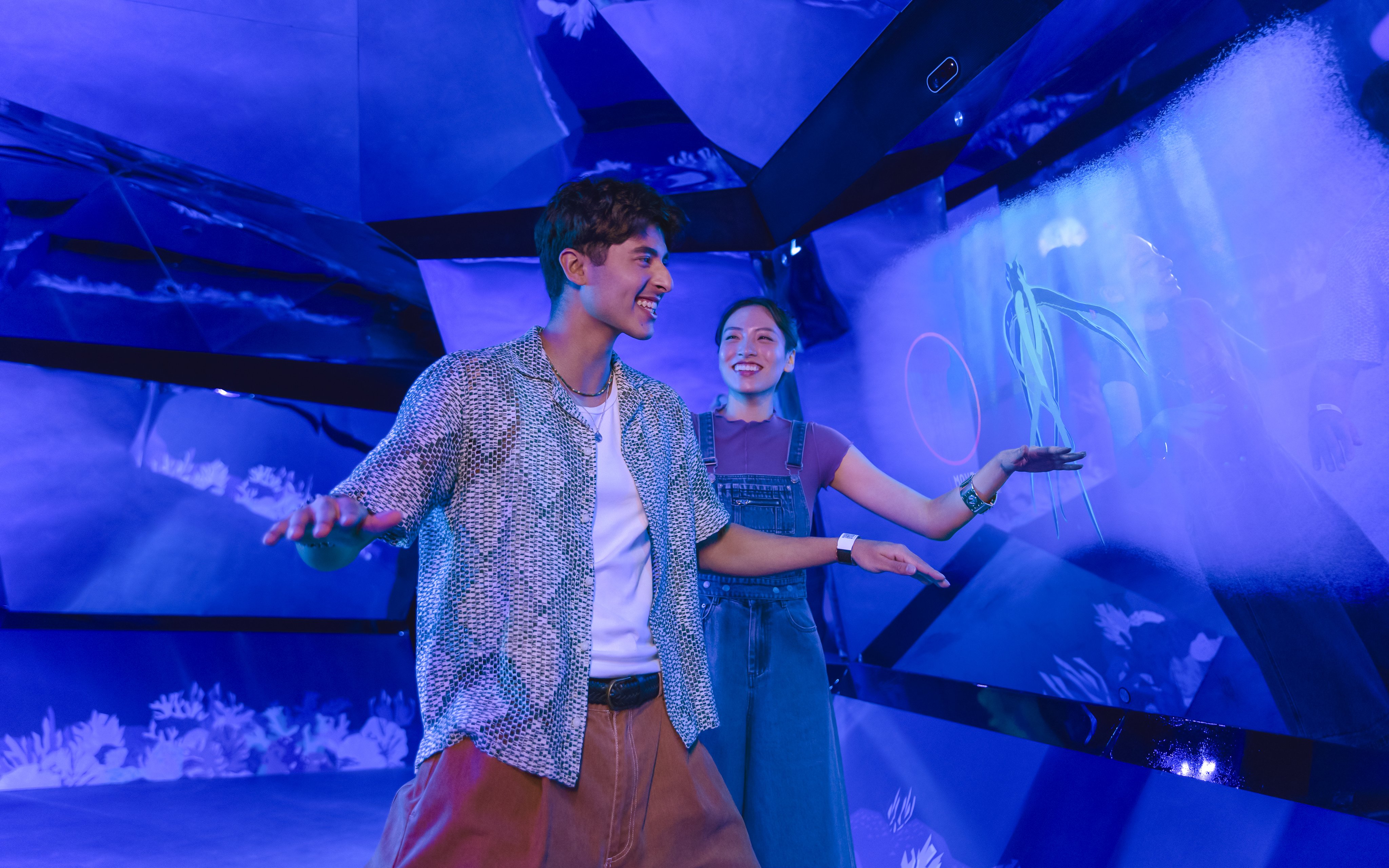 Visitors enjoying interactive rainforest exhibit at Exploria, Mandai Wildlife.