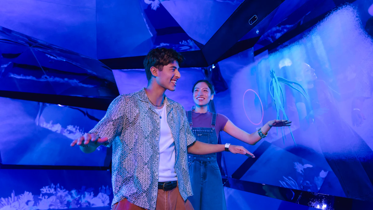 Visitors enjoying interactive rainforest exhibit at Exploria, Mandai Wildlife.
