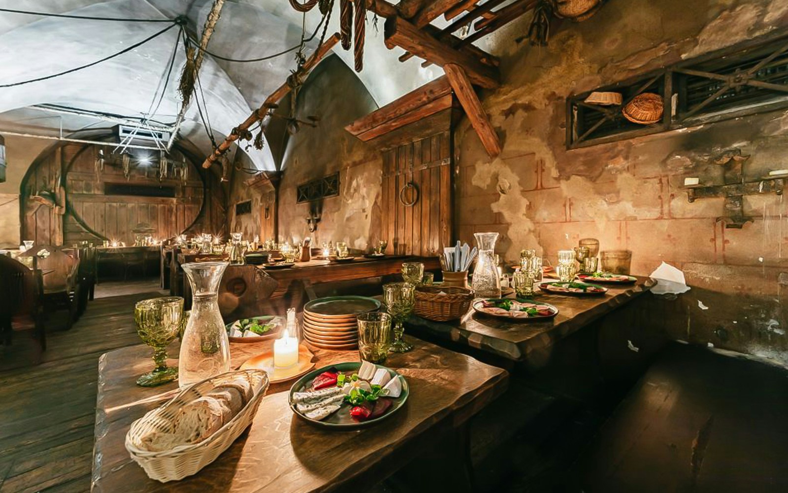 Medieval-themed dining hall with guests enjoying a three-course dinner in Prague.