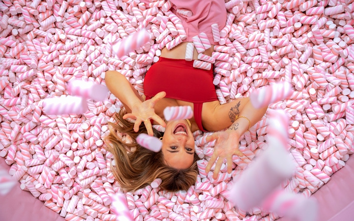 Person enjoying marshmallow pool at WONDR Experience.