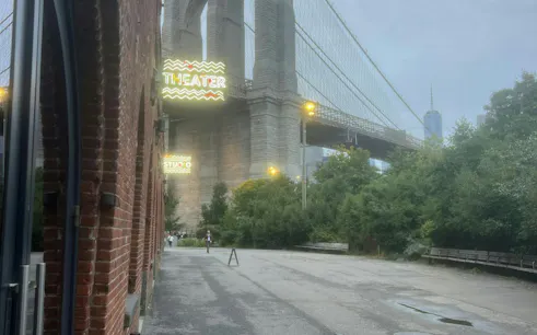 Brooklyn Bridge view from DUMBO with theater signs, New York City exploration game.