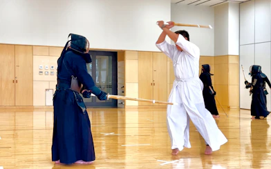 Samurai training session with kendo swords in Sapporo dojo.