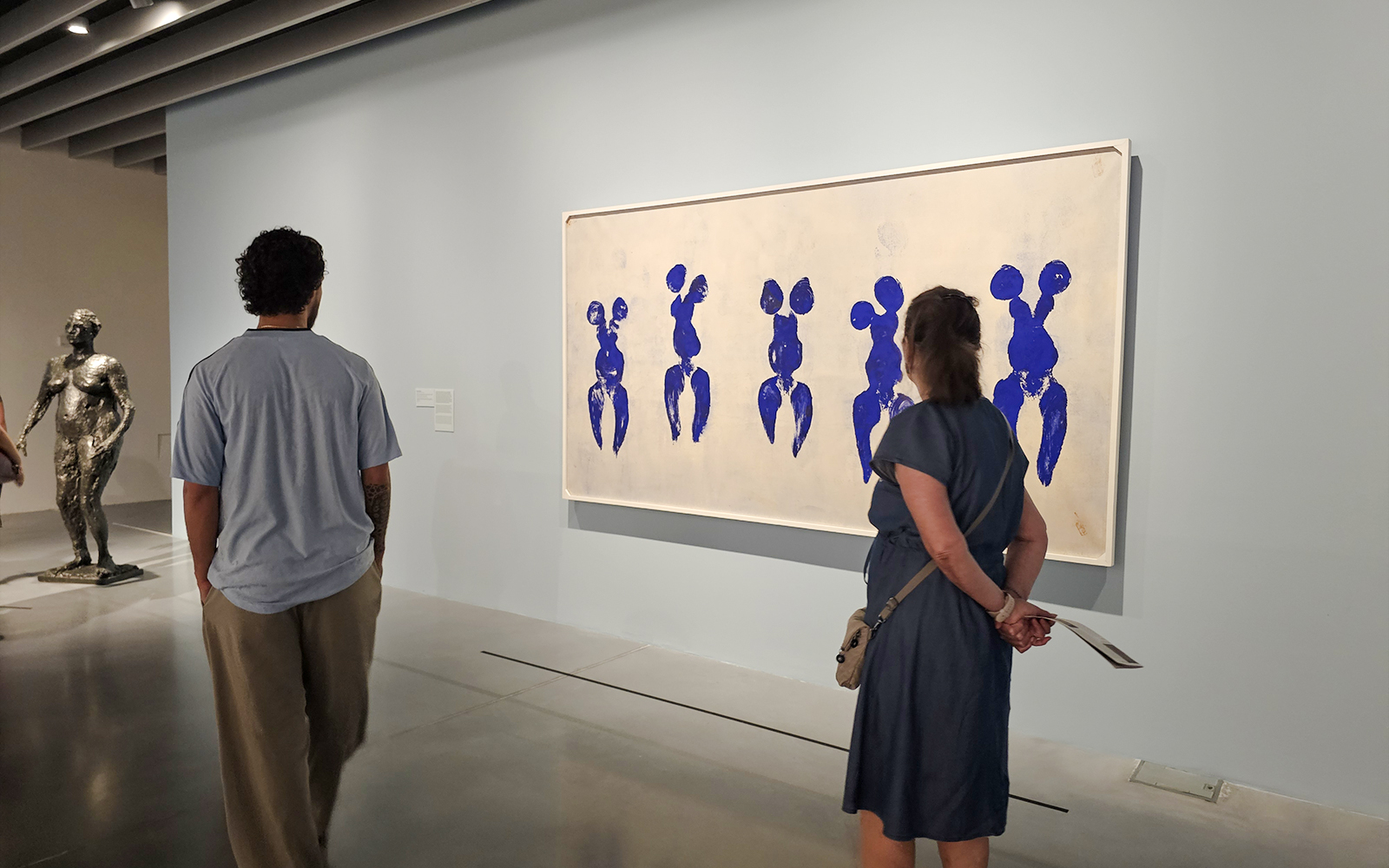 Visitors viewing artwork at Centre Pompidou Malaga exhibition interior.