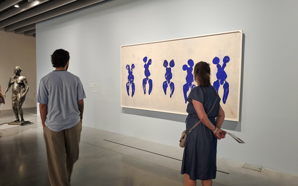 Visitors viewing artwork at Centre Pompidou Malaga exhibition interior.