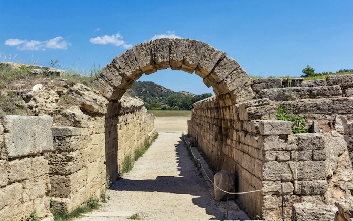 Ancient stone archway at Olympia Stadium, Greece, on Athens to Ancient Olympia tour.