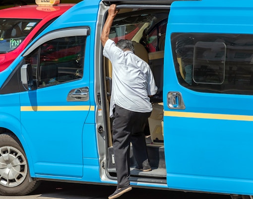 Tiger Park Pattaya shared taxi service with tourists boarding in Thailand.