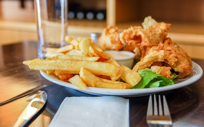 Fish and chips served at the winery cafe with a side of greens.