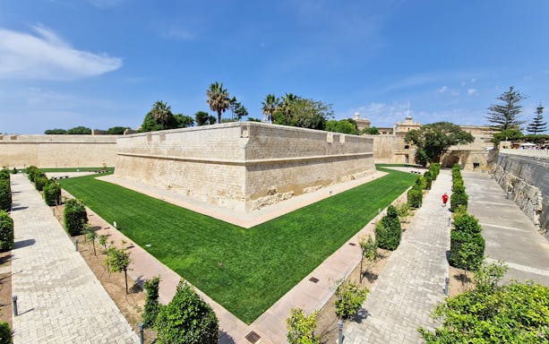 Mdina city walls and gardens on a sunny day during a 2.5-hour guided tour of Mdina and Rabat.