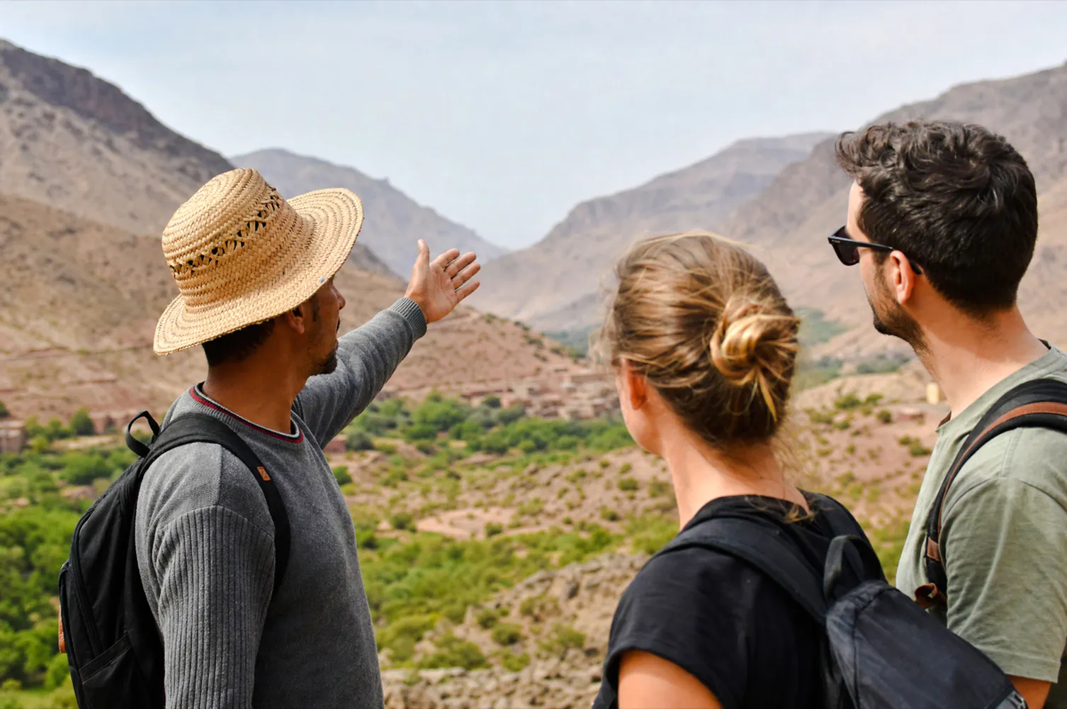 Guide showing tourists the Atlas Mountains near Marrakech.