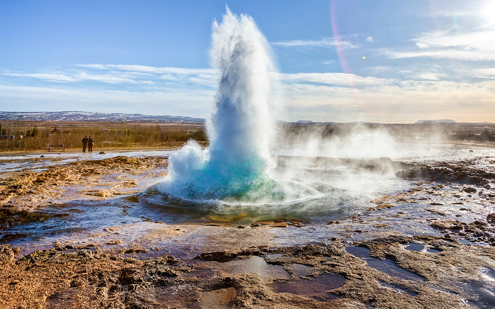 Why visit the Geysir geothermal area?