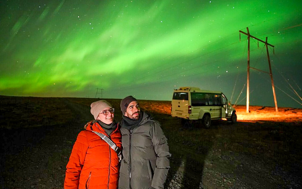 Guests viewing northern lights on Premium Northern Lights Super Jeep Tour.