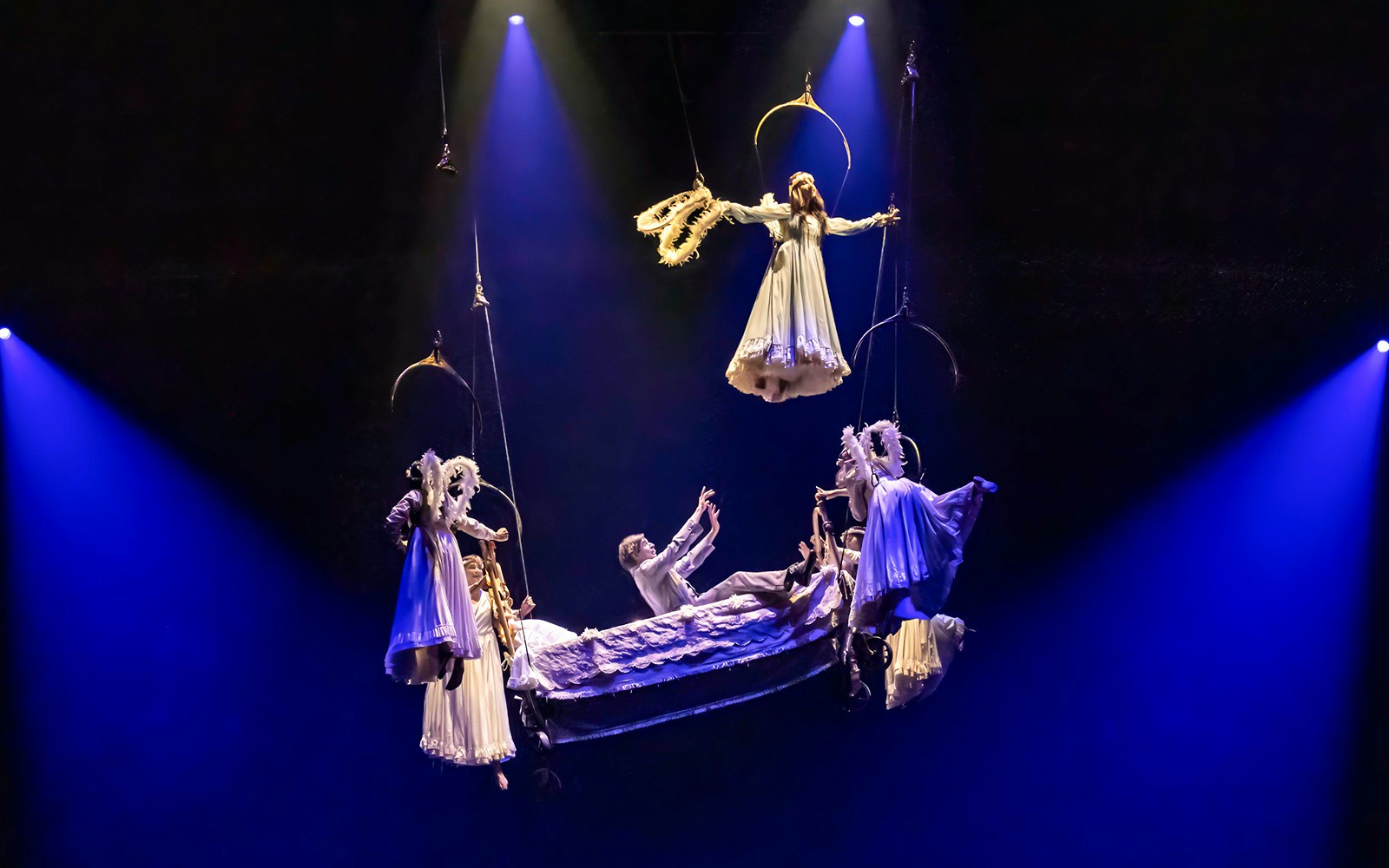 Cirque du Soleil Corteo performers in acrobatic act with suspended hoops, Tokyo, Japan.