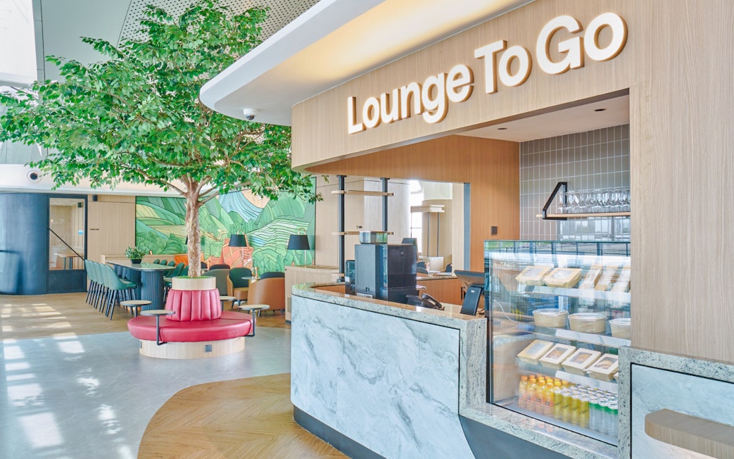 Lounge entrance with seating area and snack counter.