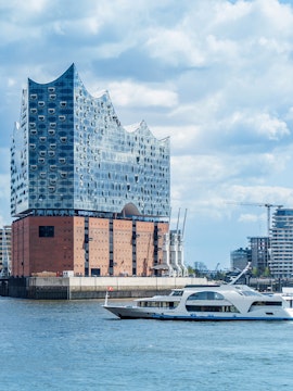 Elbphilharmonie concert hall and boat on Hamburg harbor cruise.