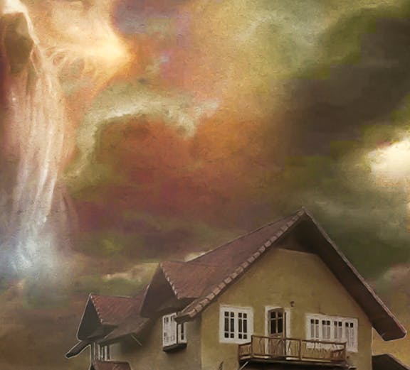Haunted house with eerie sky, Trapped Escape Room experience.