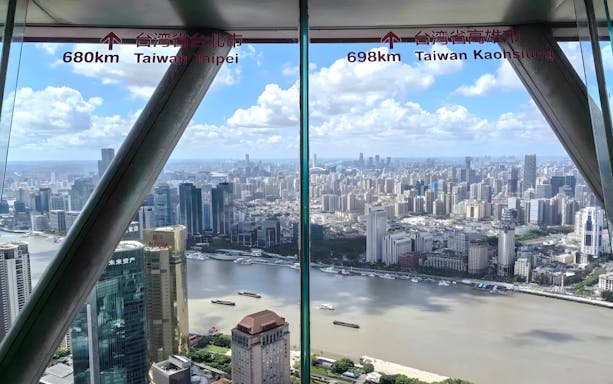 Panoramic view of Shanghai skyline from Oriental Pearl Tower observation deck.
