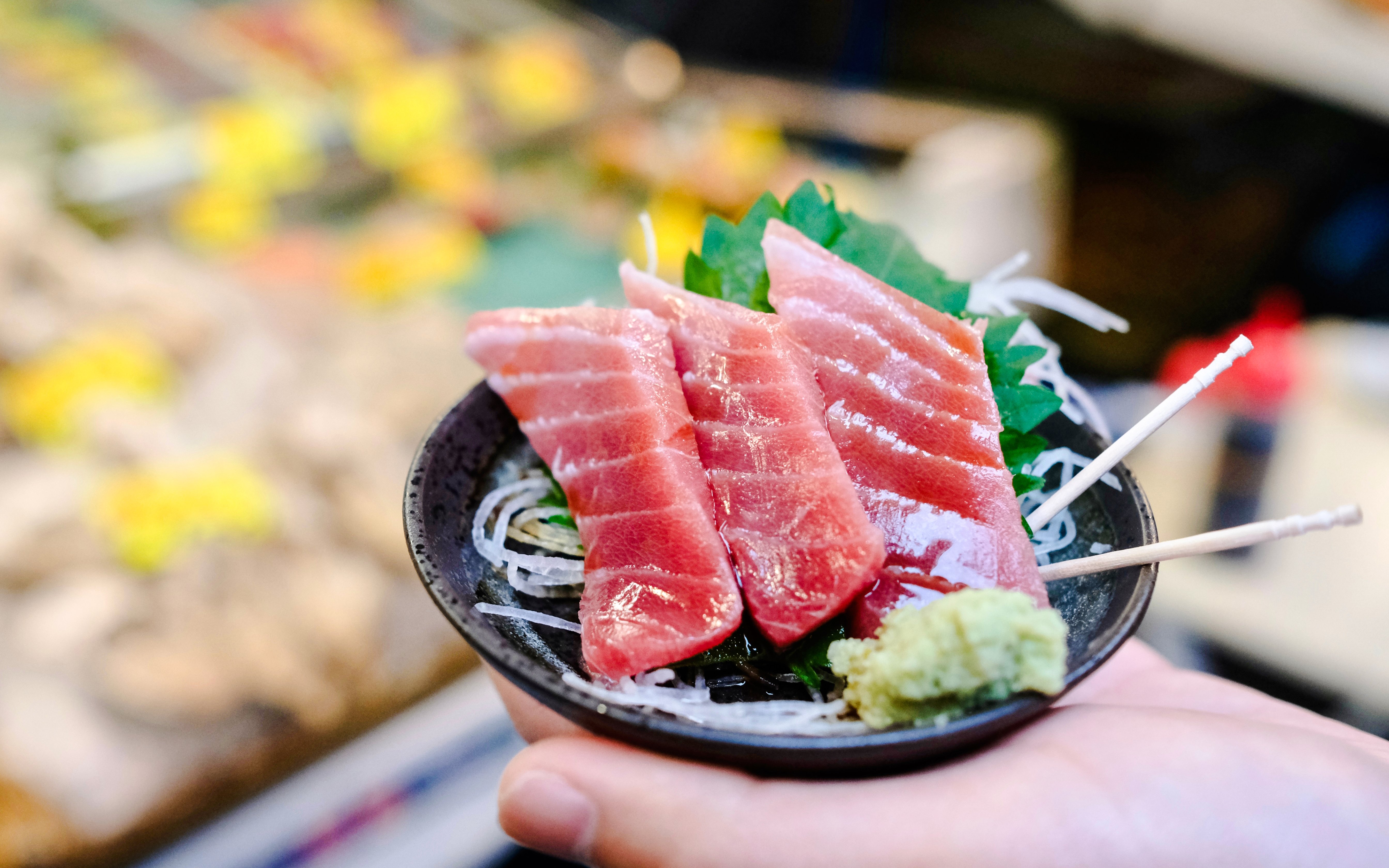 Fatty tuna sashimi with soy glaze, perilla leaf, and wasabi at Tsukiji Outer Fish Market.