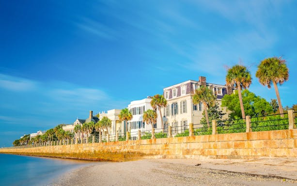 Historic homes and palm trees along the waterfront at Battery Park, Charleston.