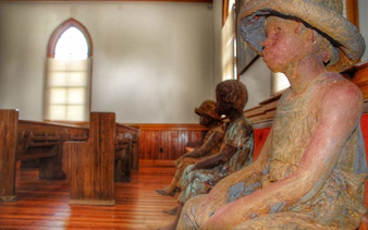 Statues of children in a church at Whitney Plantation, New Orleans.