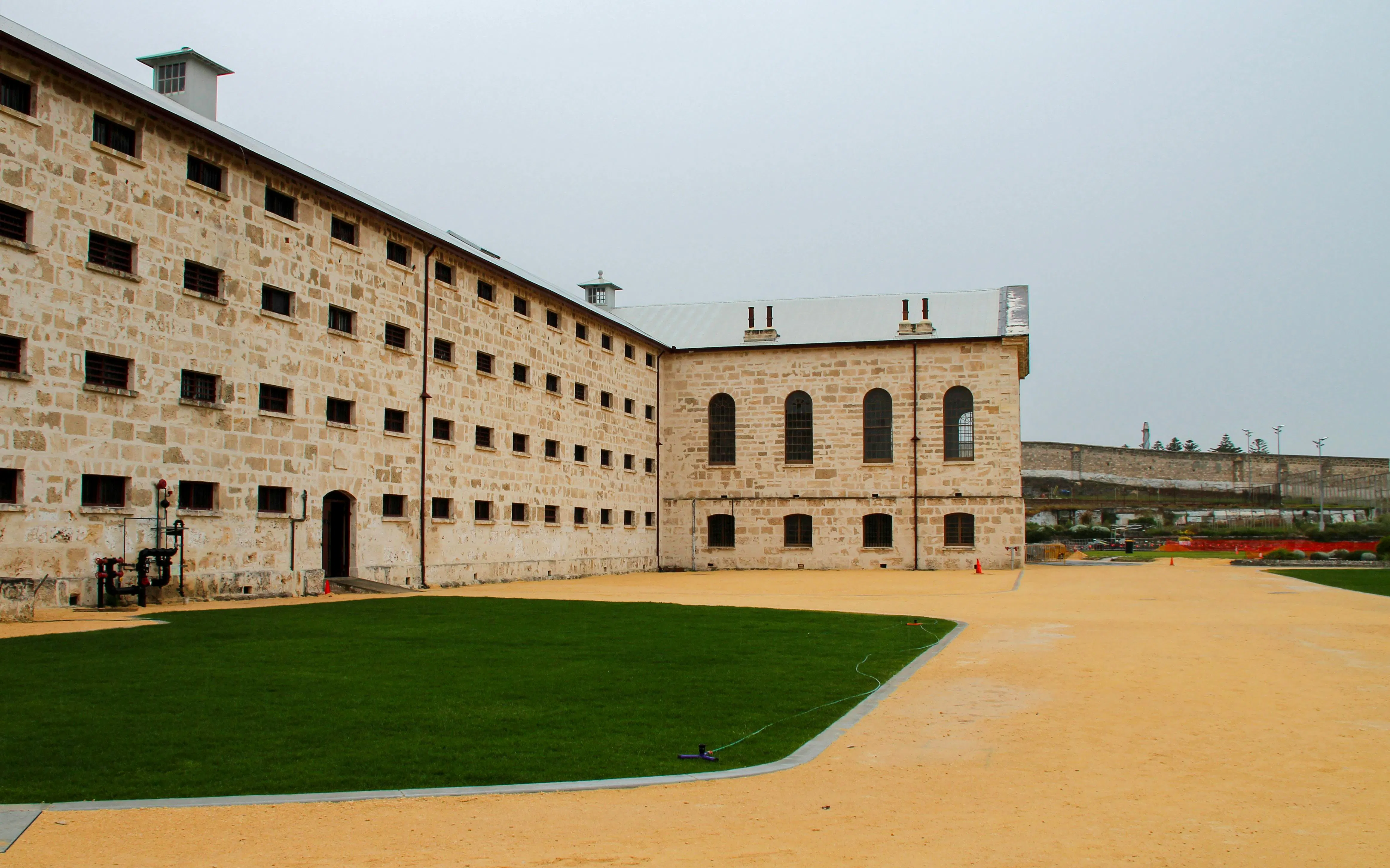 Historic Fremantle Prison courtyard with limestone walls, Western Australia.