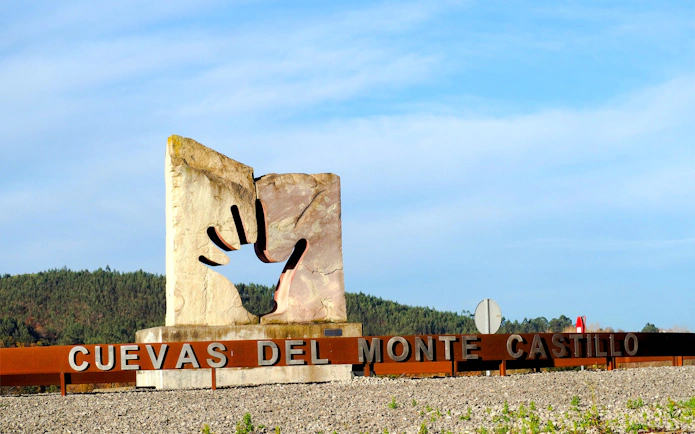 Monument at entrance to Cuevas del Monte Castillo, Puente Viesgo, Cantabria, Spain.