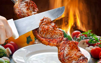 Slicing grilled meat at a Brazilian steakhouse in Rio de Janeiro.