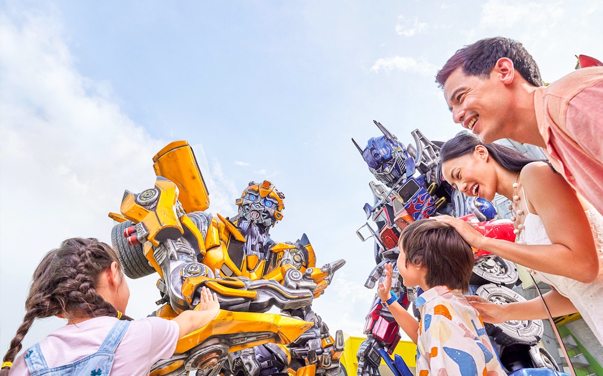Visitors interacting with Transformers characters at Universal Studios Singapore.