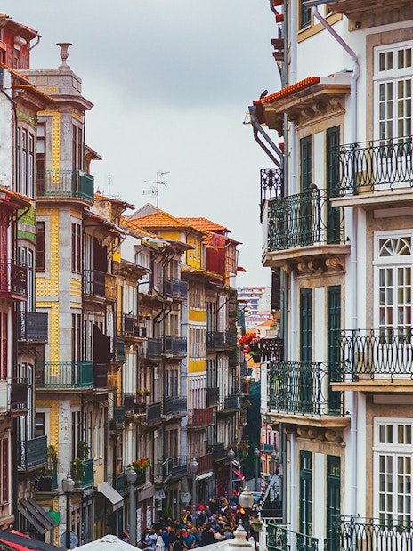 Colorful buildings on a narrow street in Porto near Misericórdia Museum and Church.