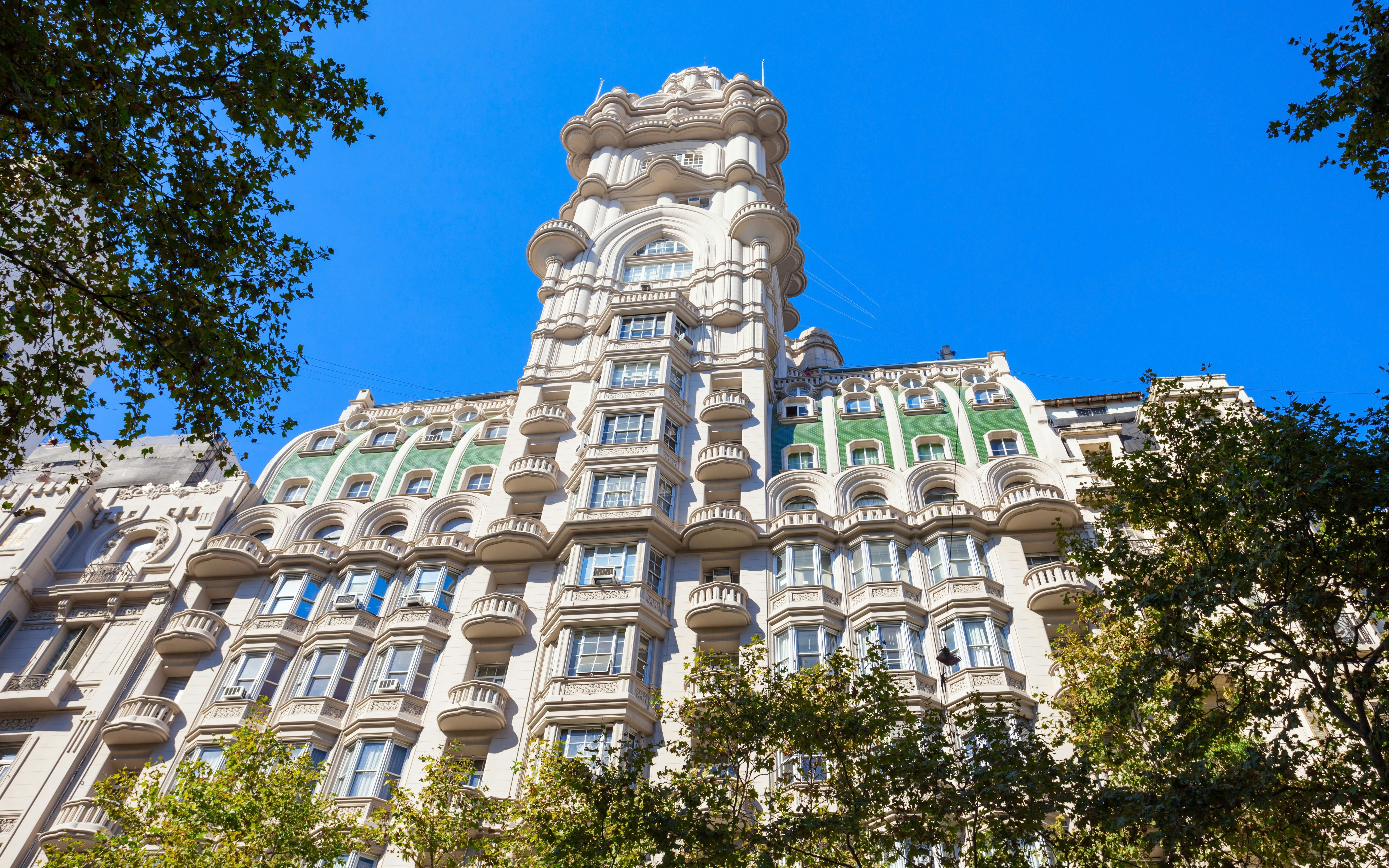 Palacio Barolo's ornate facade against a clear blue sky in Buenos Aires.