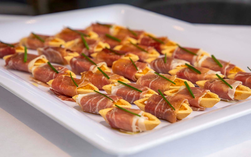 Prosciutto-wrapped appetizers on a platter, served on the London Dinner Cruise.