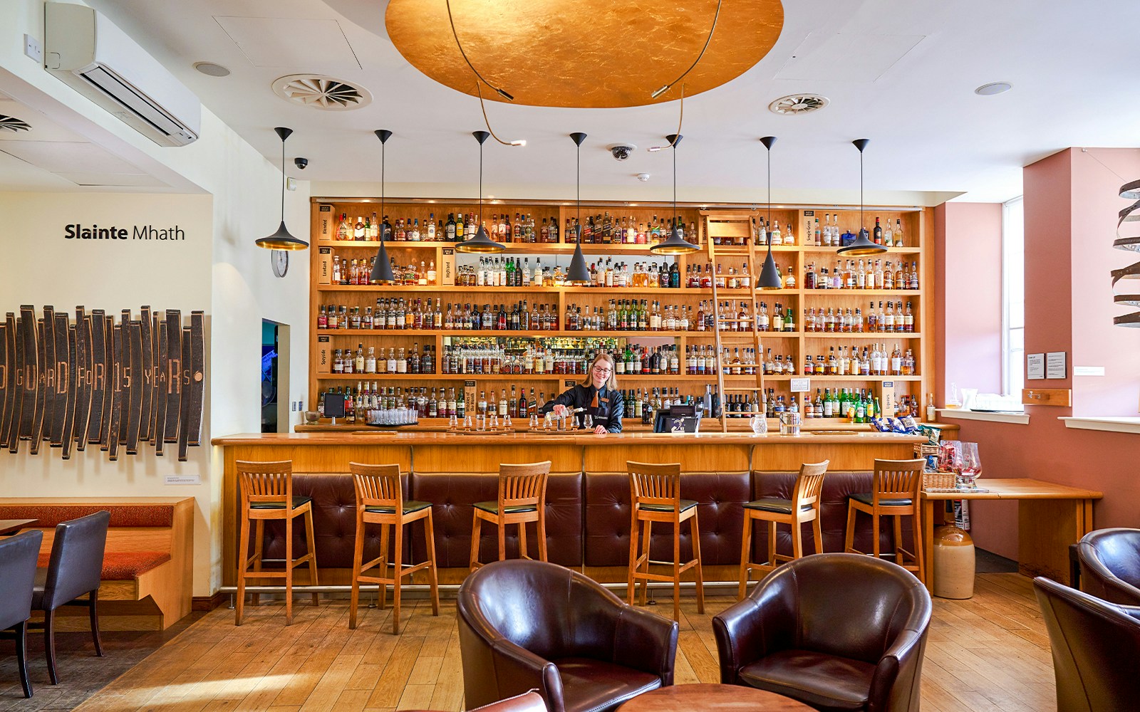 Scotch Whisky Experience Gold Tour, Edinburgh, showcasing whisky barrels and tasting room.