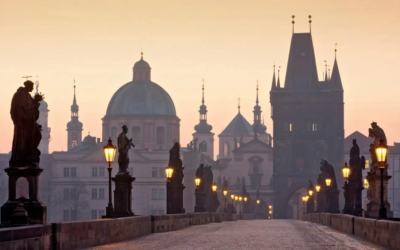 Charles Bridge statues and towers at sunrise, Prague Alchemy Mission game location.