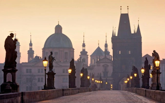 Charles Bridge statues and towers at sunrise, Prague Alchemy Mission game location.