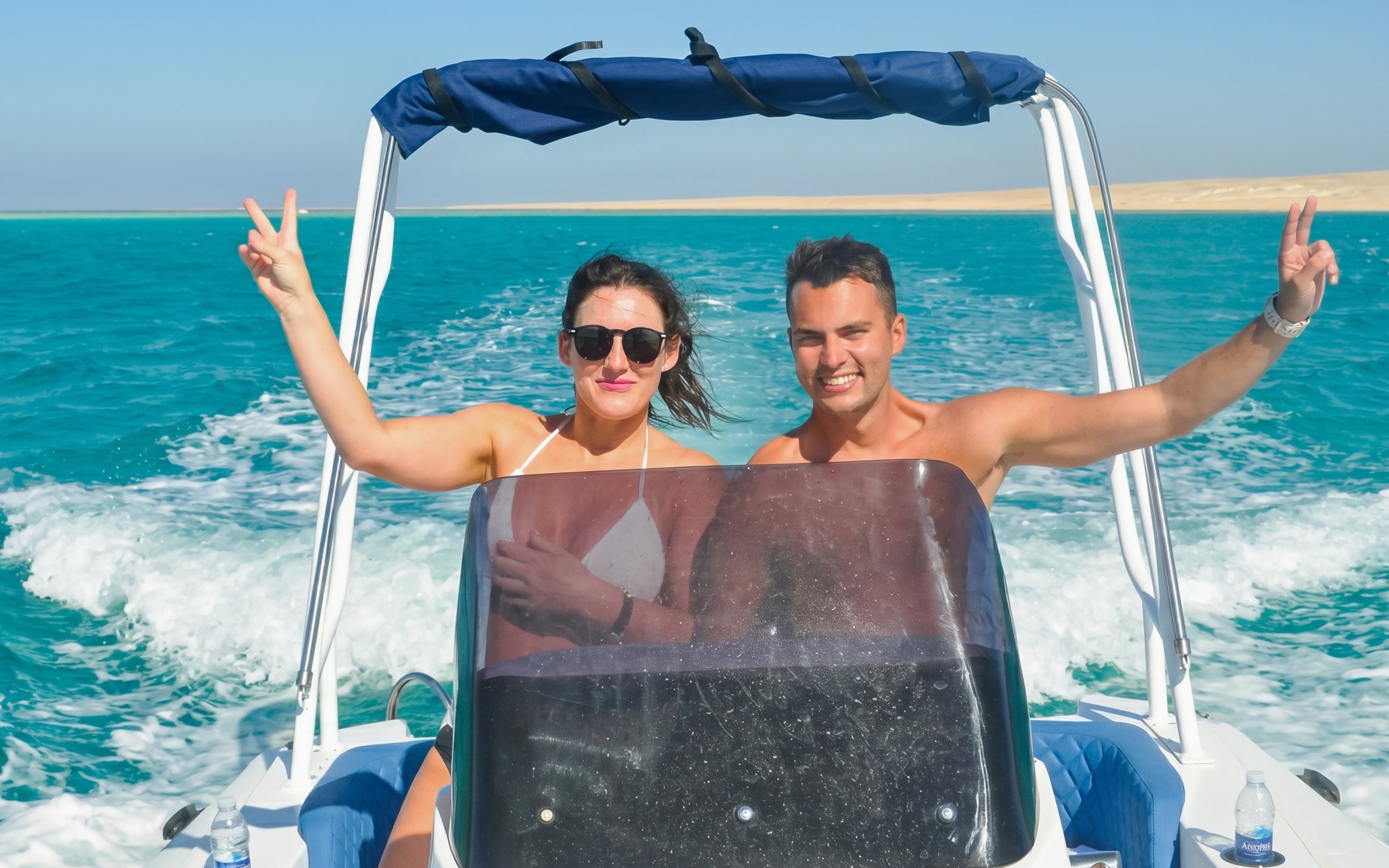High-speed sea taxi on turquoise waters to Orange Bay or Magawish.