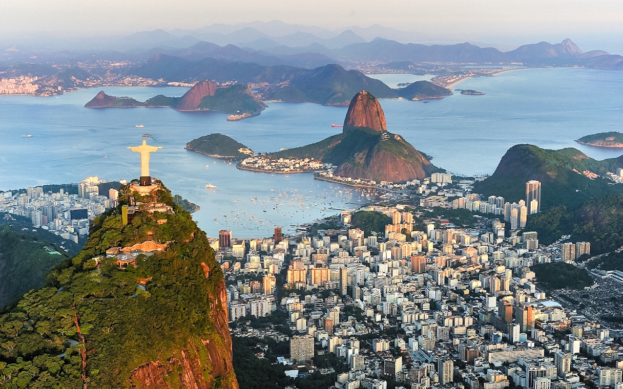 Aerial view of Christ the Redeemer, Sugarloaf Mountain, and Guanabara Bay in Rio de Janeiro.
