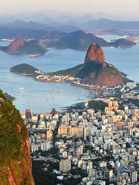 Aerial view of Christ the Redeemer, Sugarloaf Mountain, and Guanabara Bay in Rio de Janeiro.