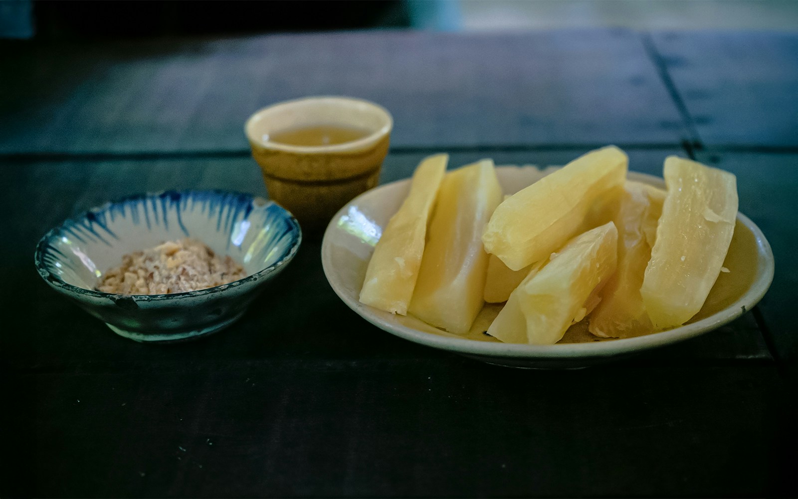 Sugar cane pieces and peanuts in bowls, Cu Chi Tunnel wartime diet.