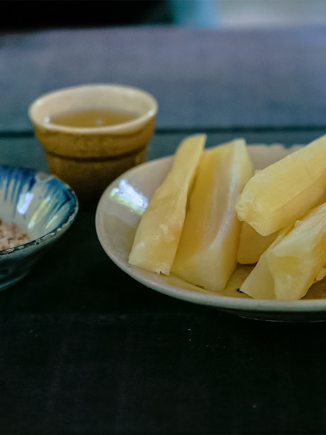 Sugar cane pieces and peanuts in bowls, Cu Chi Tunnel wartime diet.