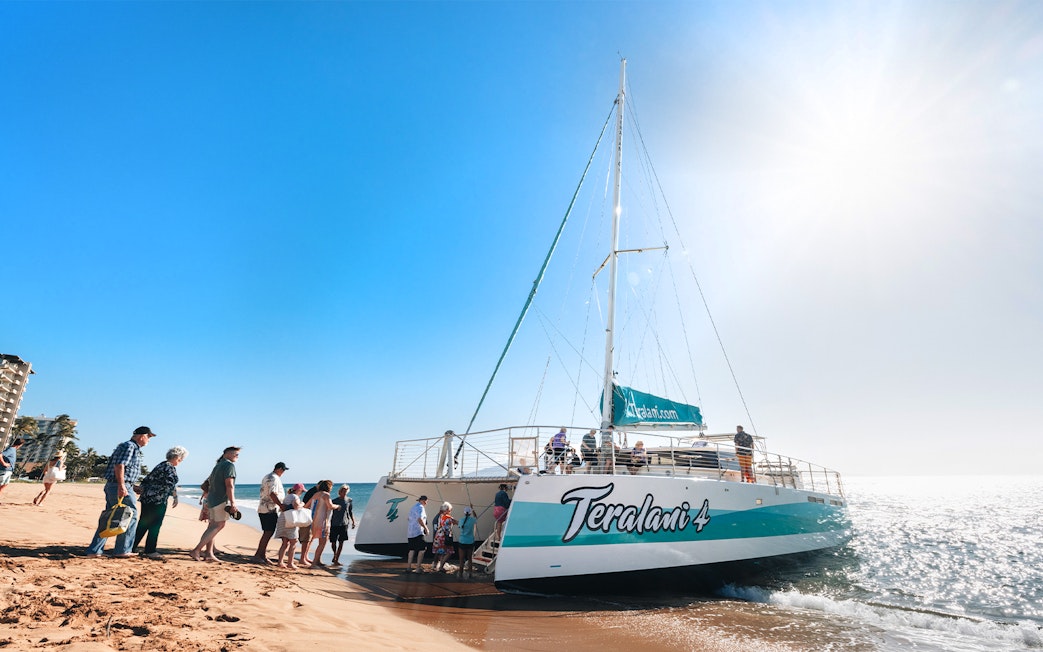 Boarding a catamaran for a whale watching tour at Kaʻanapali Beach, Maui, Hawaii.