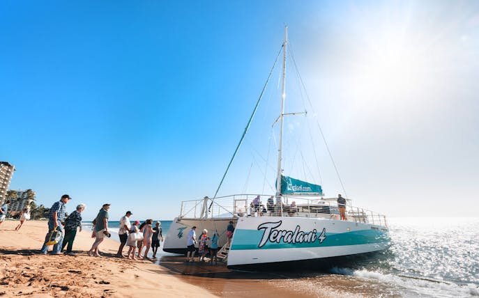 Boarding a catamaran for a whale watching tour at Kaʻanapali Beach, Maui, Hawaii.