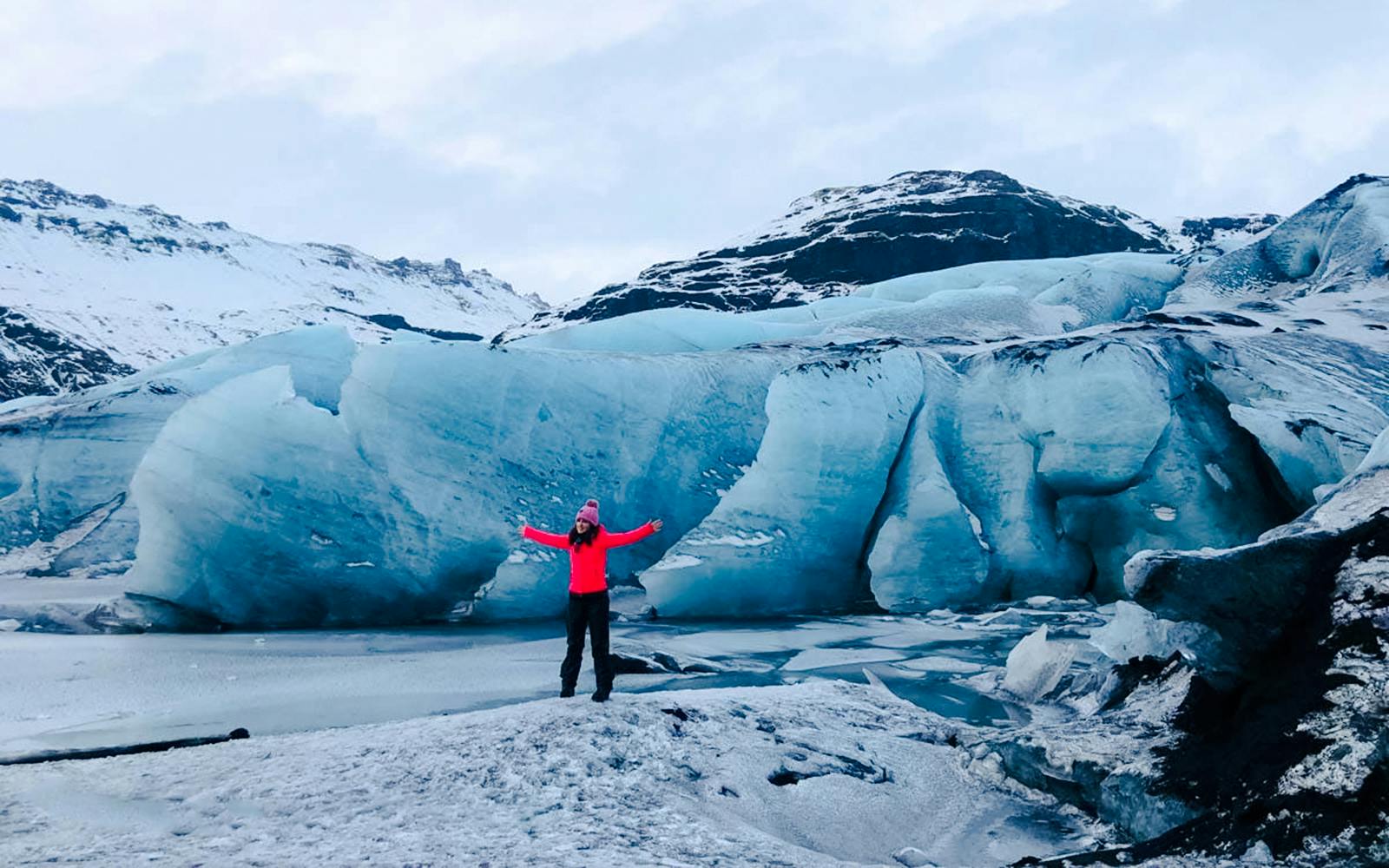 Guests exploring Solheimajokull glacier in Iceland with icy landscape.
