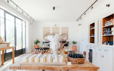 Provence Terre Ugo shop interior with local products displayed on wooden table.