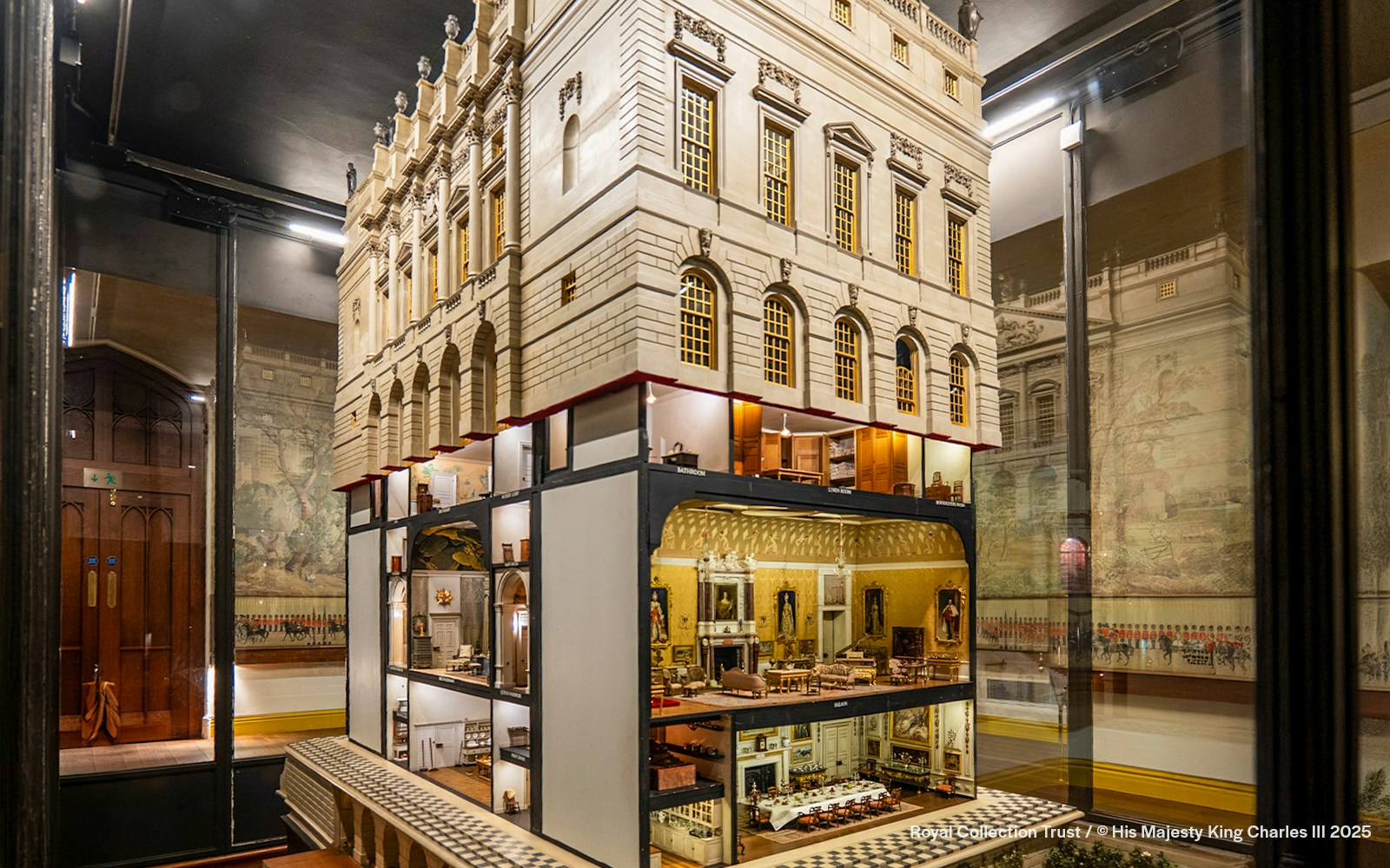 Queen Mary's Doll's House interior at Windsor Castle, showcasing detailed miniature rooms.