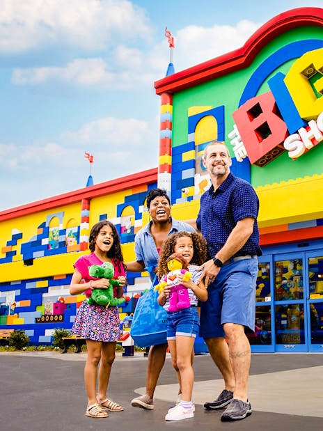 Guests enjoying the colorful entrance of The Big Shop at Legoland, New York.
