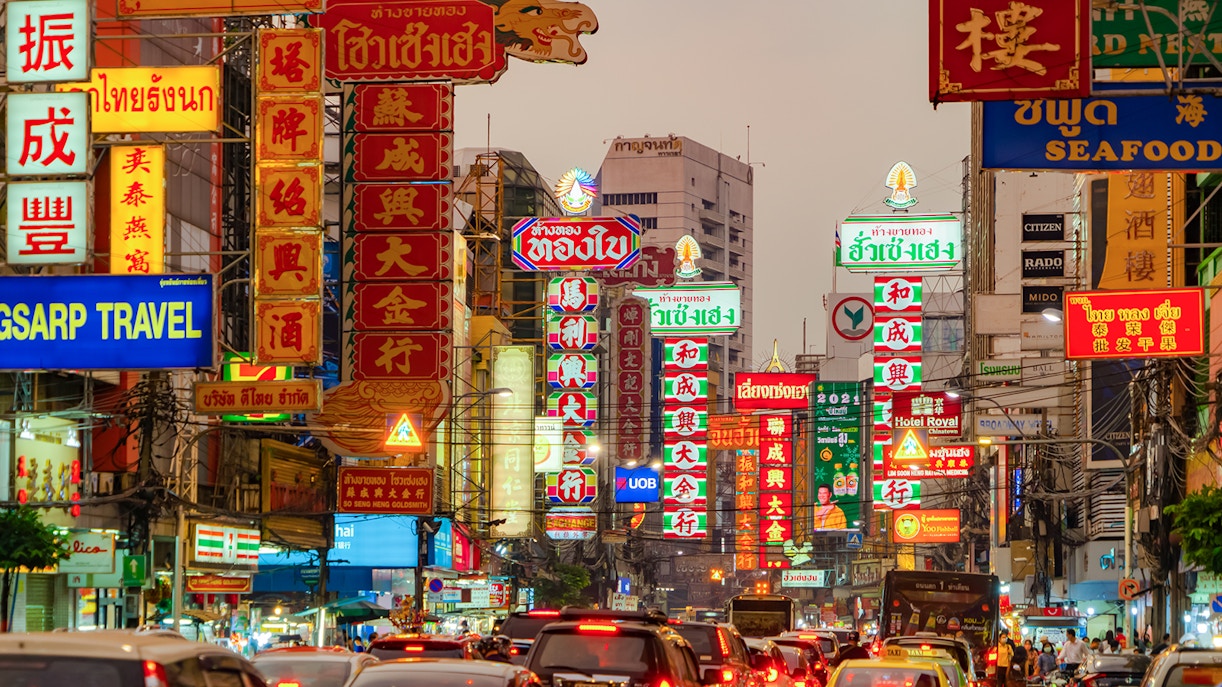 Night market street with Chinese signs on Yaowarat Road, Bangkok, Thailand.