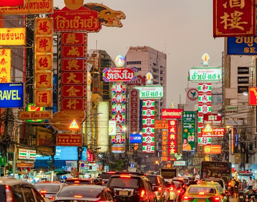 Night market street with Chinese signs on Yaowarat Road, Bangkok, Thailand.