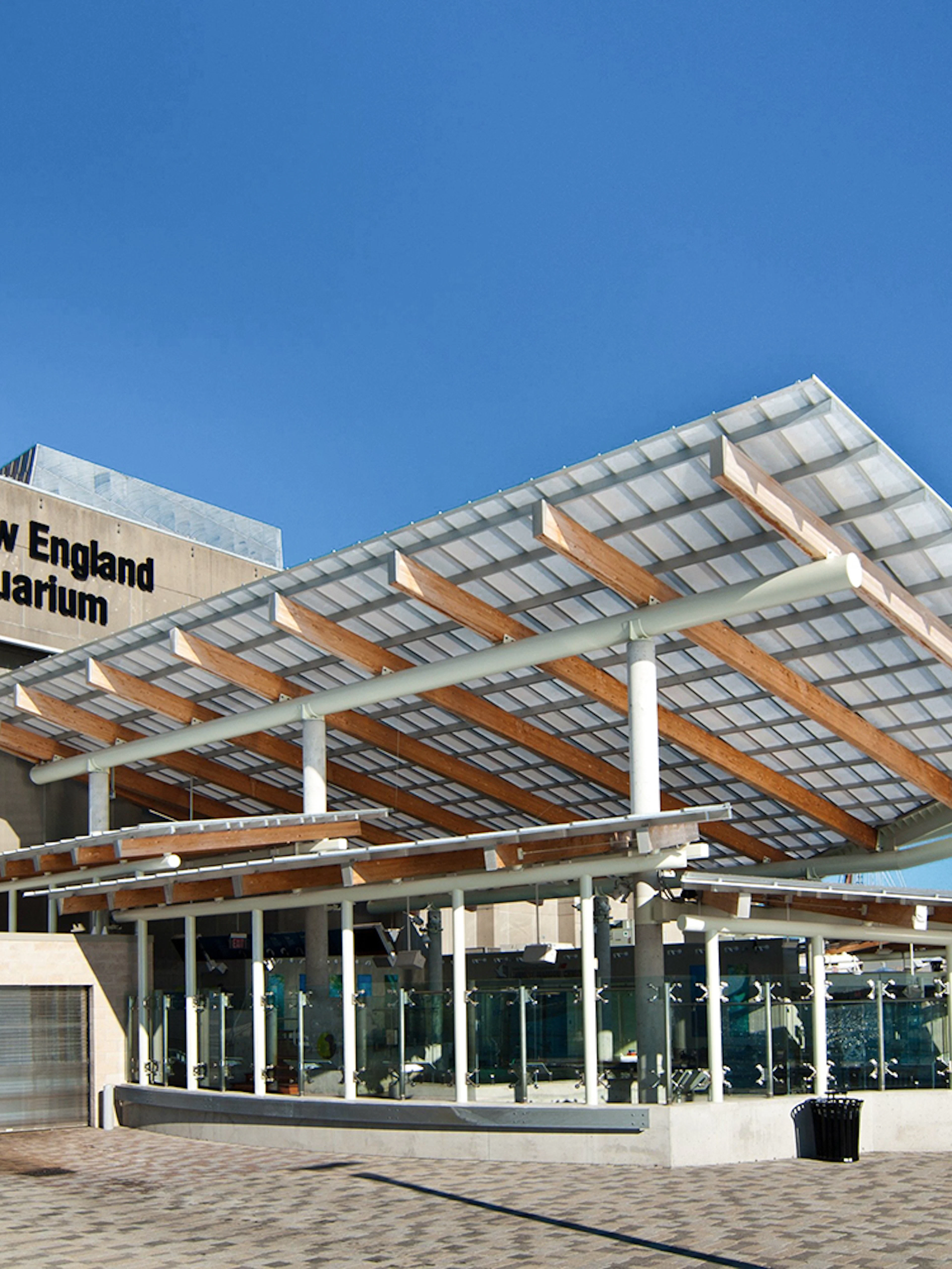 New England Aquarium exterior with modern glass and wood design.
